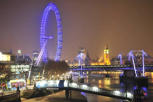 Bronze lion statue at Trafalgar Square, London: A symbol of strength and pride in the heart of the city.